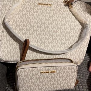 Have this cream and brown Michael Kors purse and wallet set. Excellent condition